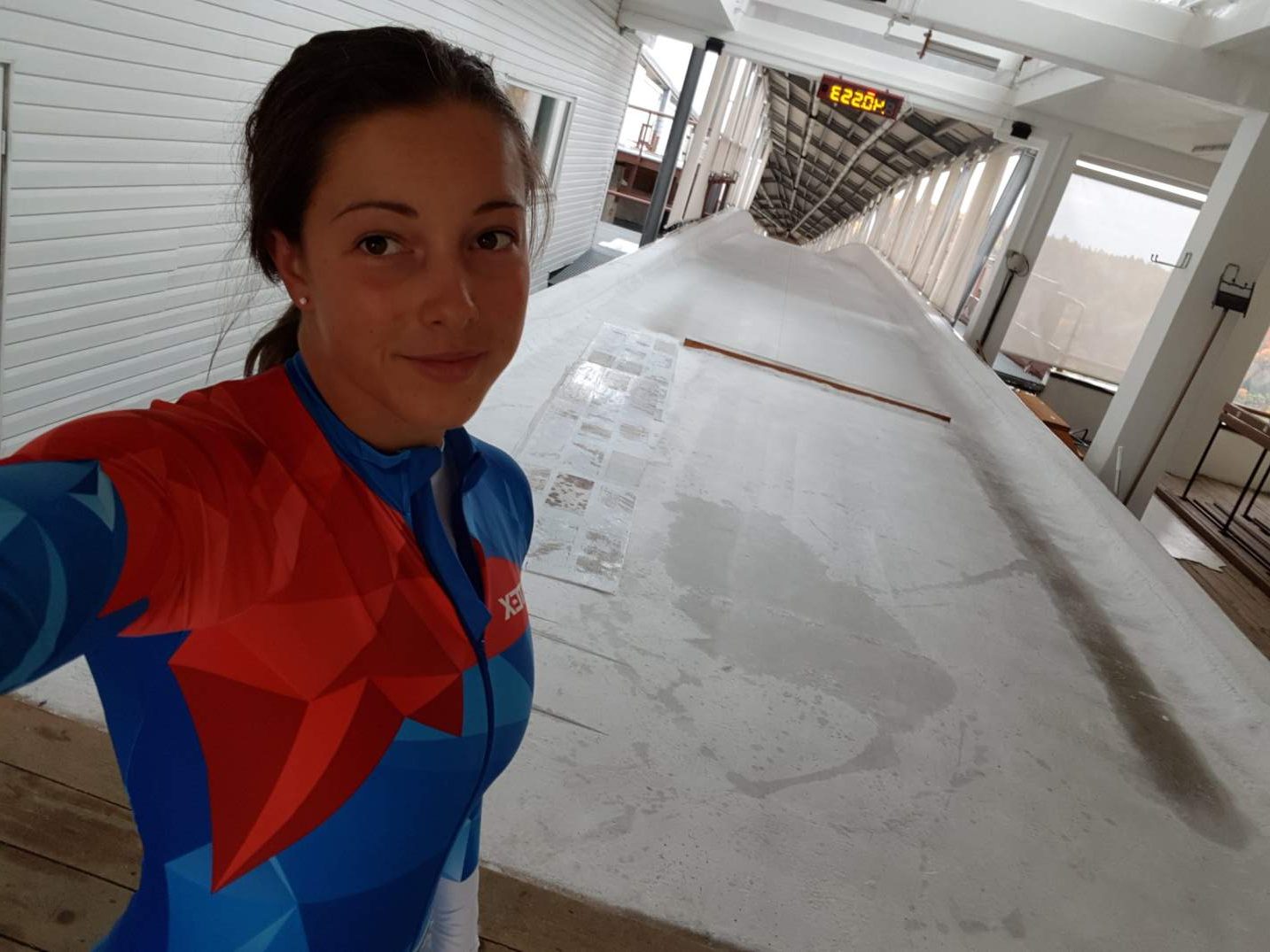 Anna Fernstaedt stands at the top of the skeleton track